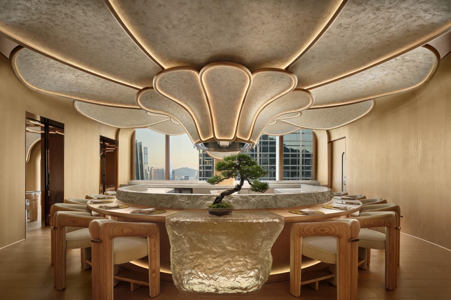 Dining room with a nature-inspired ceiling installation