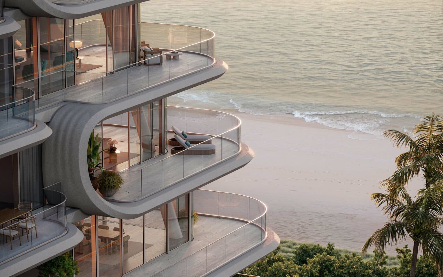 Curved balcony terrace furnished with outdoor lounge seating overlooking the sea
